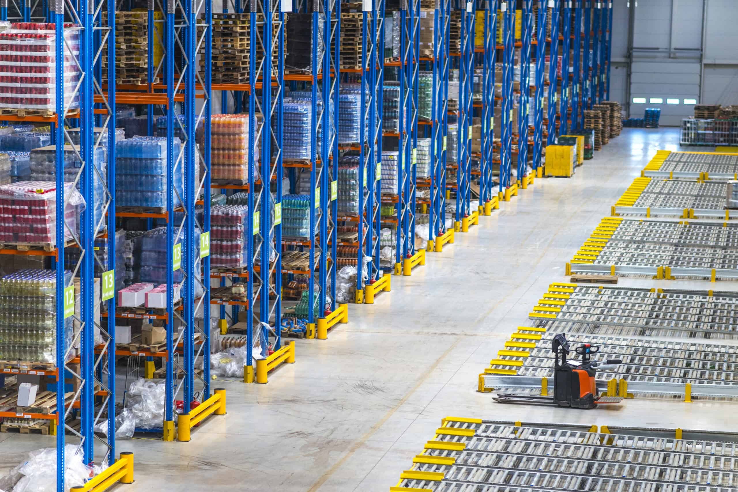 Distribution warehouse building interior and large storage area with goods on the shelf